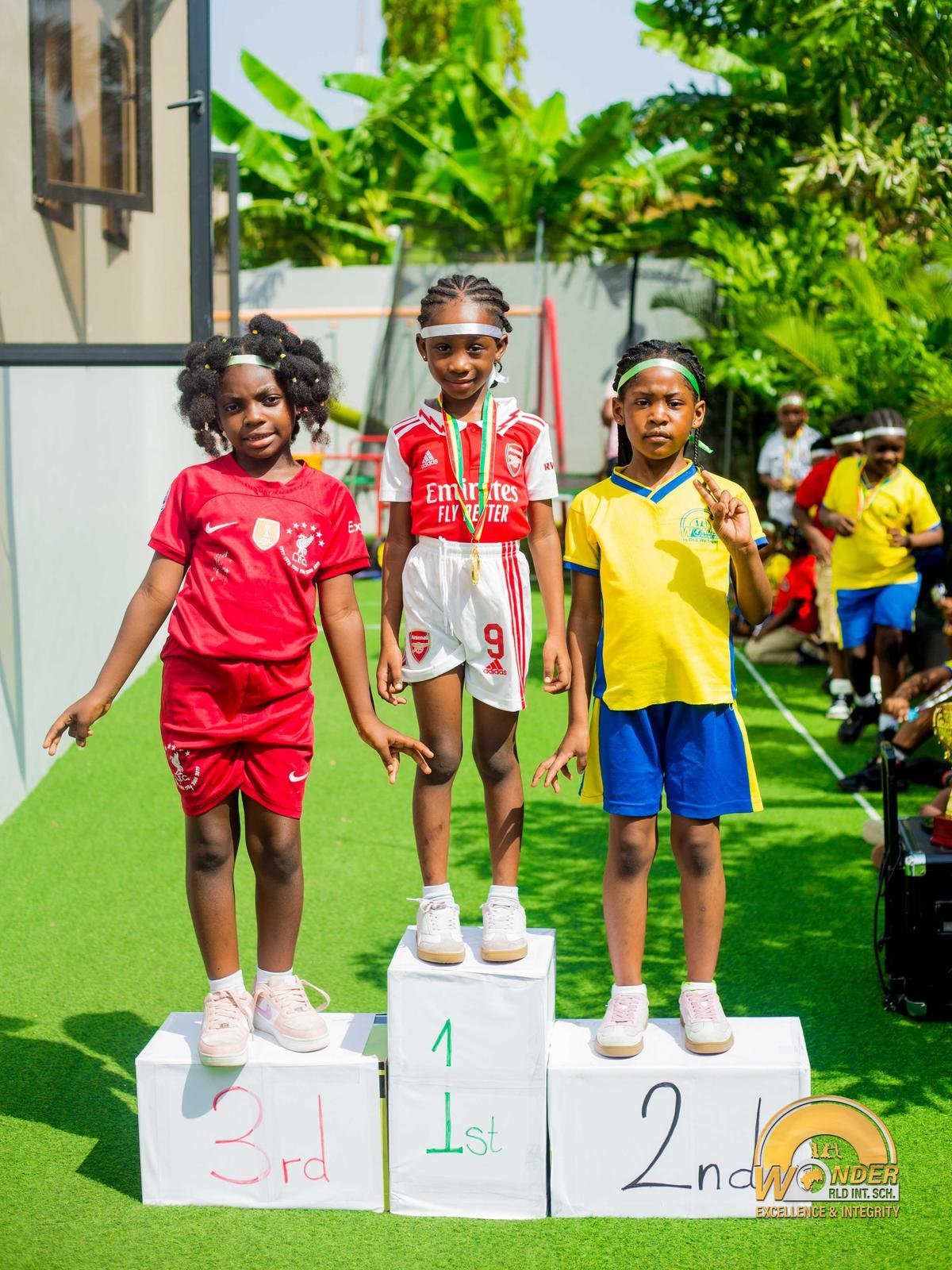 Students on the podium at a school sports day